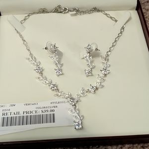 Silver floral necklace with matching earrings.